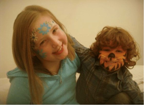 Image showing young Emily and her brother wearing face paint